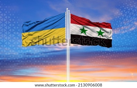 Ukraine and Syria two flags on flagpoles and blue sky

