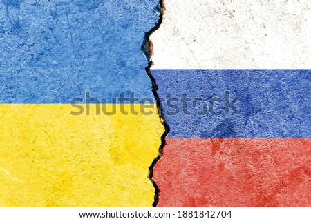 Ukraine VS Russia national flags isolated on broken wall with cracks background, abstract Ukraine Russia politics economy culture history war relationship conflicts concept