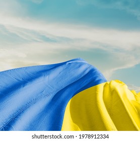 Ukraine waving flag in the sky. - Shutterstock ID 1978912334