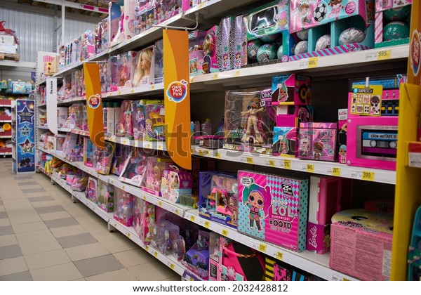 Ukraine,Dnepropetrovsk.05.06.2021Shelf with many\
colored toys. Blurred of kids toy store background. Variety of\
construction toys on shelves in a store.Toy colored plastic cars in\
the children\'s\
store