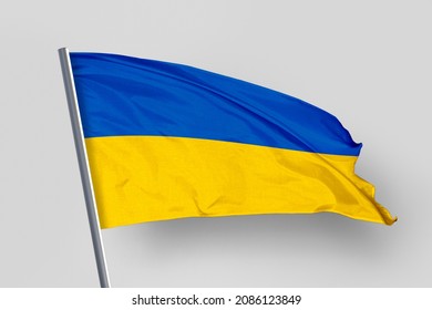 Ukraine's flag is isolated on a white background. flag symbols of Ukraine. close up of a Ukrainian flag waving in the wind.