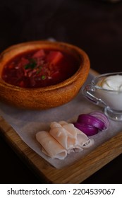 Ukrainian Borscht In Bread With Lard And Onion