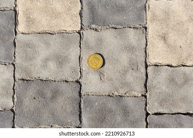 Ukrainian Coin On The Sidewalk. Money Is On The Ground.