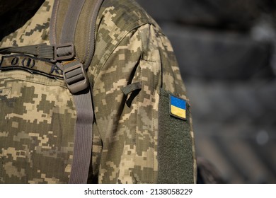 Ukrainian Flag On A Military Uniform, War. Soldier Of The Armed Forces Of Ukraine. Territorial Defense. Macro