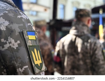 Ukrainian flag on military uniform. A funerals of Ukrainian servicemen.  - Shutterstock ID 2216116807