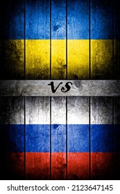 Ukrainian flag vs Russian on a wooden background.
ukraine russia conflict 2021 escalation
