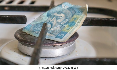 Ukrainian Hryvnia On A Gas Water Heater Without Fire. Gas Stove With Money. Conceptual Image Of A Rising Tariff For Violence. Natural Gas Saving Concept At Home, High Gas Prices