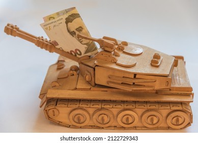 Ukrainian Hryvnia And Wooden Tank