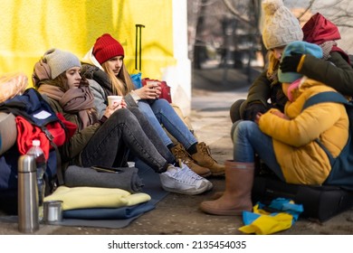 Ukrainian immigrants crossing border and sitting and waiting for registration. - Shutterstock ID 2135454035