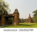 “Entrance to the Ukrainian Memorial at Tingui Park, Curitiba, Brazil, highlighting the traditional Orthodox Catholic temple with wooden architecture, surrounded by lush greenery and clear skies.”