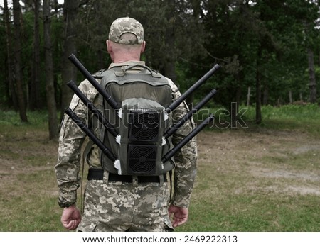 Ukrainian military with anti-drone backpack. WB, radio-electronic warfare.