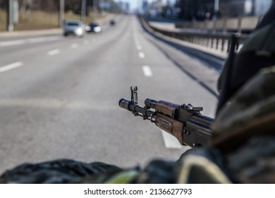 Ukrainian Military In Check Point With A Machine Gun In His Hands. Russian War Against Ukraine