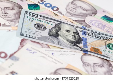 Ukrainian Money - Hryvnia Banknotes USA Dollars Bills. Finance In Ukraine, Of The Hryvnia To The Dollar Exchange Rate. Multi Currency Money Dollars And Hryvnia, Close-up Concept Finance Investment.