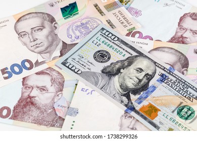 Ukrainian Money - Hryvnia Banknotes USA Dollars Bills. Finance In Ukraine, Of The Hryvnia To The Dollar Exchange Rate. Multi Currency Money Dollars And Hryvnia, Close-up Concept Finance Investment.