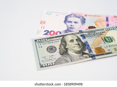 Ukrainian Money - Hryvnia Banknotes USA Dollars Bills. Finance In Ukraine, Of The Hryvnia To The Dollar Exchange Rate. Multi Currency Money Dollars And Hryvnia, Close-up Concept Finance Investment.