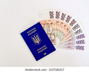 Ukrainian passport and five thousand Czech crowns on white background, top view. Social aid to refugees from Ukraine