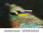 Ukrainian and Russian flag on Ukraine geopolitical map. War, Conflict, Crisis concept in Europe. High quality photo