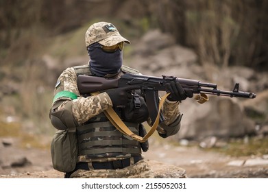 Ukrainian Soldier Of The Armed Forces Of Ukraine Sits Taking Aim