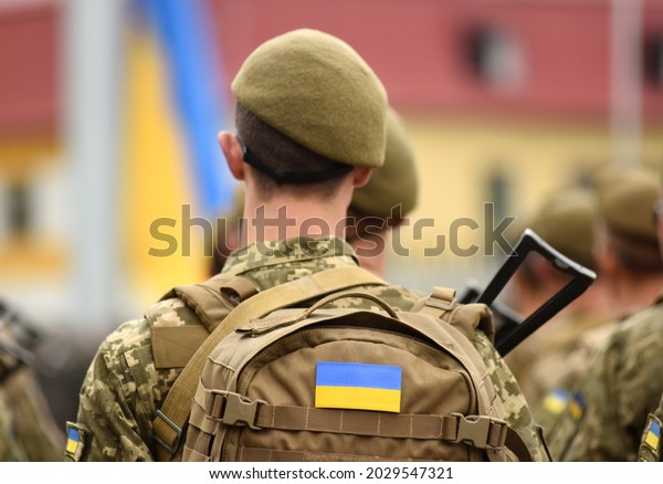 Ukrainian soldier. Ukrainian in army.\
Ukrainian flag on military uniform. Troops of\
Ukraine.