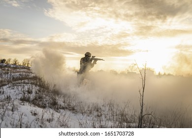 Ukrainian Soldier Near Kharkiv, Ukraine With Full Equipment Helmet And Gun Watch Battlefield. Modern Army Soldier