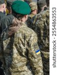 Ukrainian woman soldiers on military parade. Ukrainian flag on military uniform. Woman in army