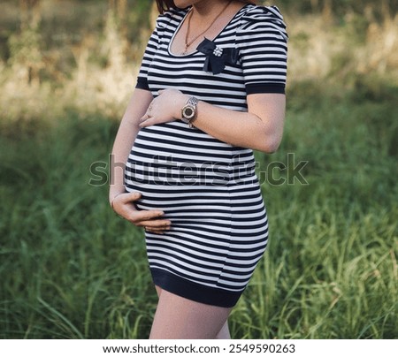 Similar – Unrecognizable pregnant woman showing ultrasound of her baby on the mobile