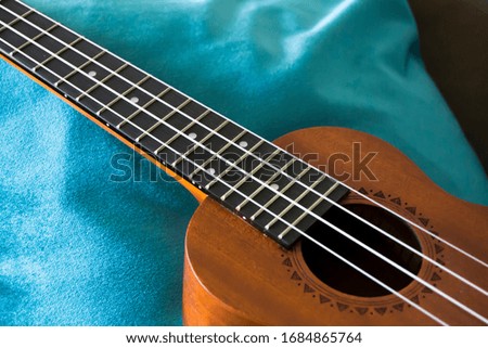 ukulele in close over sofa