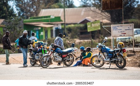 Ukunda, Kenya - September 19, 2016: A Local Motorcycle Gang On The Street Of A Small Town In Kenya. Motorbike Is The Main Mode Of Transport In Kenya.