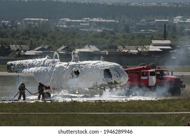 Ulan-Ude, Republic Of Buryatia, Russia - July 25 2008 OF THE YEAR
Aerodrome Fire Brigade Training -the Helicopter Exploded, Fell To The Ground And Burned. Rescue Exercises In A Plane Crash.