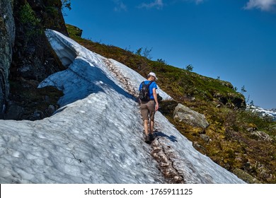 Ullensvang, Norway - 06.27.2020: A Man Hiking The Famous Trail Called Dronningstien, Named After HM Queen Sonja Of Norway