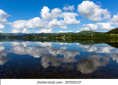 Ullswater Lake District Cumbria England UK With Mountains And Blue Sky On Beautiful Calm Sunny Summer Day With Reflections And Clouds From Sunny Weather