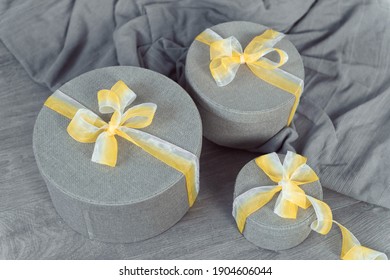 Ultimate Gray Round Gift Boxes Illuminating Yellow Ribbon Bow