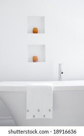 Ultra Modern Bathroom In Stark White With Orange Accent