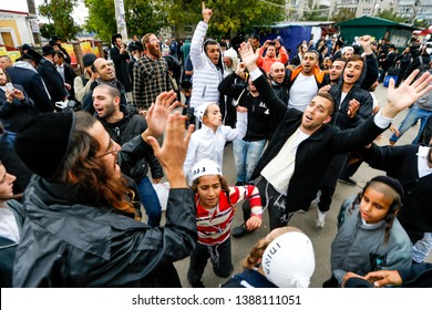 Ultra Orthodox Jewish Hasids  pilgrims dance on the street in Uman. Jewish pilgrims arrive every year on Rosh Hashanah to pray at the grave of Rabbi Nachman of Breslov. Uman, Ukraine. September 2014
