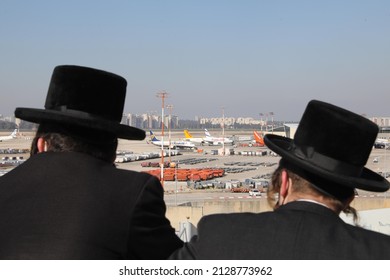 Ultra orthodox Jewish men watch over the aircraft as they wait to Kiev flight, at Israel's Ben Gurion Airport in Tel Aviv, Israel on February 13, 2022.