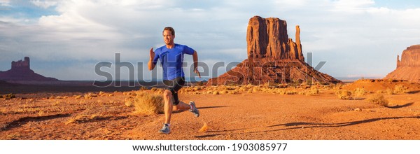 Ultra running trail athlete runner man\
training long distance endurance doing sprinting exercise desert in\
mountain landscape on outdoor run. Monument valley, USA banner\
panoramic. Sport\
lifestyle.