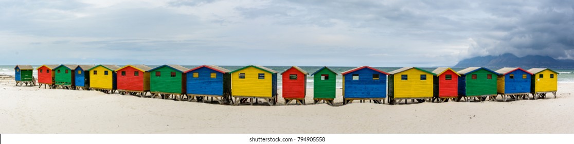 Ultra wide panorama of the colourful beach houses on Muizenberg beach - a popular tourist attraction near Cape Town, South Africa