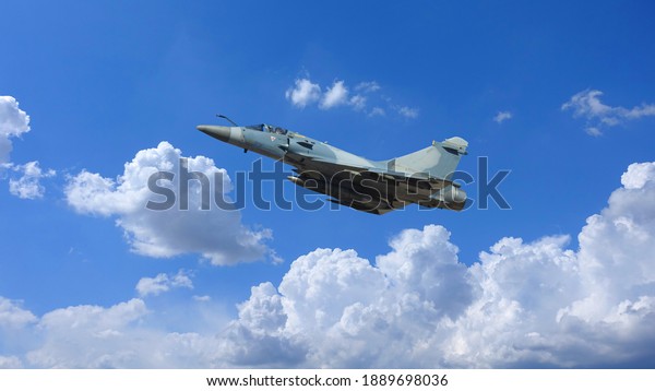 Ultra zoom photo\
of Mirage 2000 fighter interceptor plane performing extreme stunts\
in deep blue cloudy sky