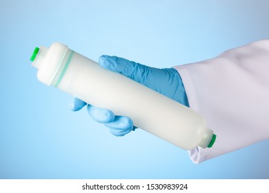 An Ultrafiltration Membrane Of Domestic Drink Water Treatment Systems In A Hand At Blue Background