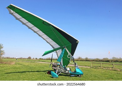 	
Ultralight airplane on a grass airfield	