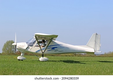 Ultralight airplane on a grass strip	