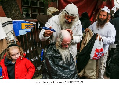 Ultra-Orthodox Jewish Hasids  pilgrims have a haircut on the eve of Rosh Hashanah holiday, the Jewish New Year, near the tomb of Rabbi Nachman of Breslov in the town of Uman, Ukraine. September 2019