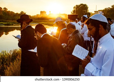 Ultra-Orthodox Jewish Hasids pilgrims pray on a bank of a lake near the tomb of Rabbi Nachman of Breslov during the celebration of Rosh Hashanah, the Jewish New Year, in Uman, Ukraine, September 2016