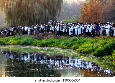 Ultra-Orthodox Jewish Hasids pilgrims pray on a bank of a lake near the tomb of Rabbi Nachman of Breslov during the celebration of Rosh Hashanah, the Jewish New Year, in Uman, Ukraine, September 2016
