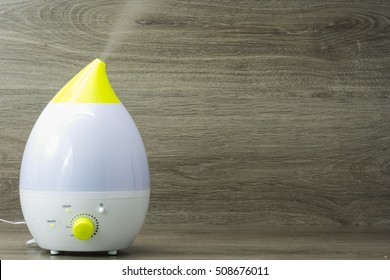 Ultrasonic Humidifier On The Grey Wooden Background