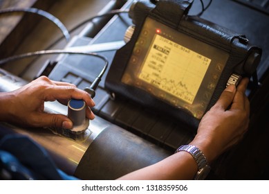 Ultrasonic test to detect imperfection or defect of round bar steel raw material in factory, NDT Inspection. - Shutterstock ID 1318359506
