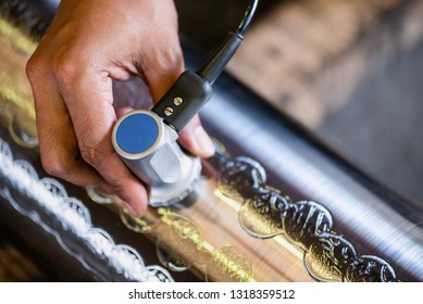 Ultrasonic test to detect imperfection or defect of round bar steel raw material in factory, NDT Inspection. - Shutterstock ID 1318359512