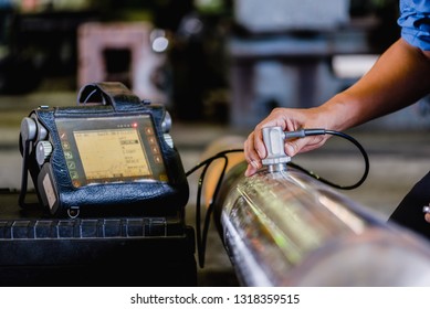 Ultrasonic test to detect imperfection or defect of round bar steel raw material in factory, NDT Inspection. - Shutterstock ID 1318359515