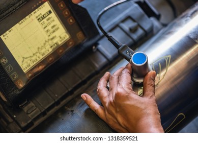 Ultrasonic test to detect imperfection or defect of round bar steel raw material in factory, NDT Inspection. - Shutterstock ID 1318359521
