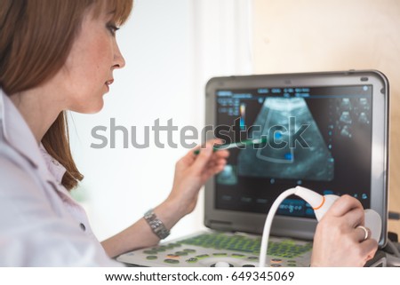 Similar – Female doctor showing an x-ray on the tablet